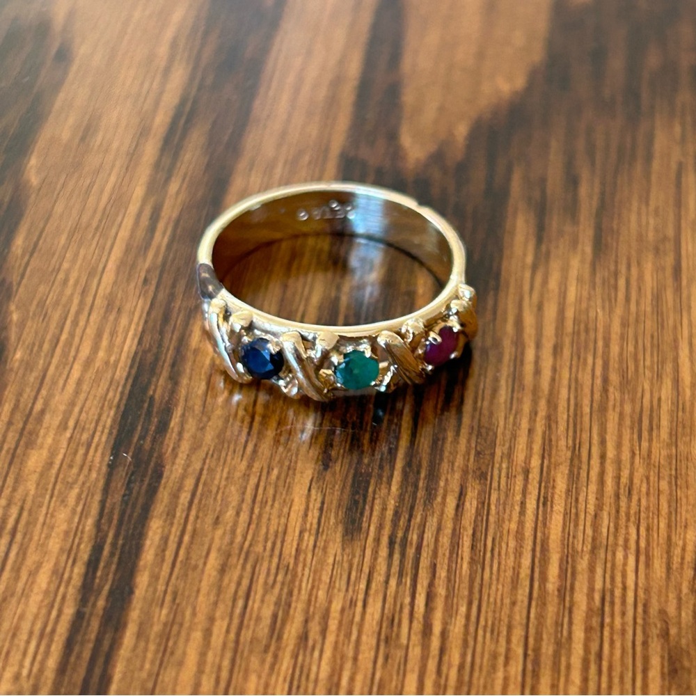 Gold plated ring with black, green, and red gemstones size 5